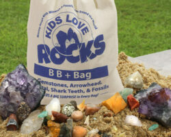 Big gemstone mining bag filled with sand and gems