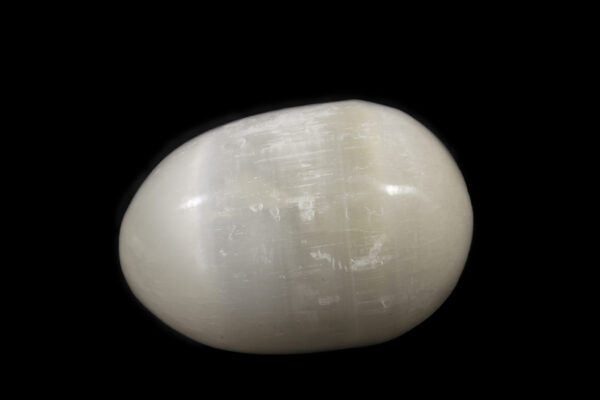 Large egg-shaped selenite stone side