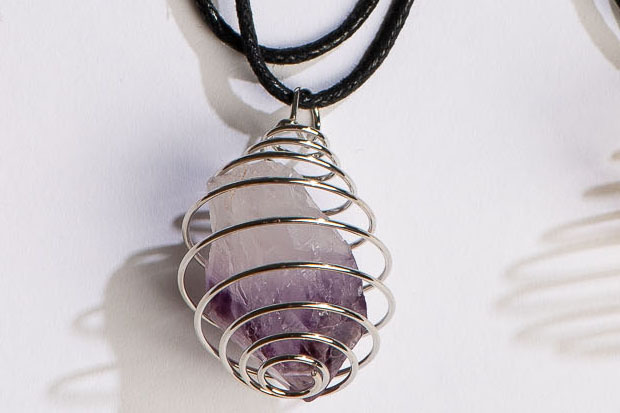 Spiral Pendant displaying gemstone inside