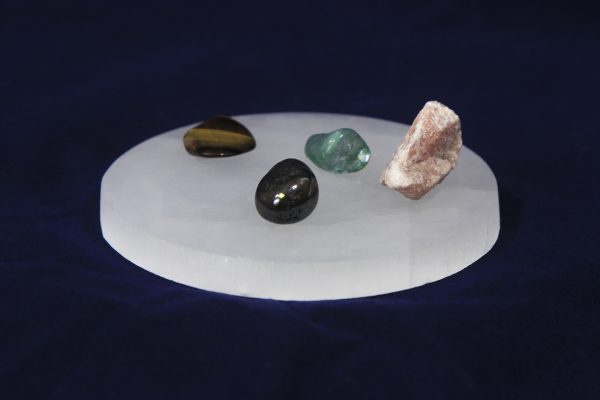 Round Selenite Charging Plate with gems for display