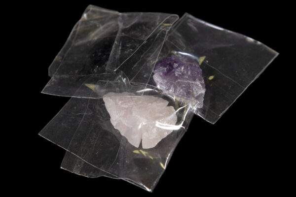 Set of Amethyst, Rose, and Obsidian Arrowheads in plastic pouches