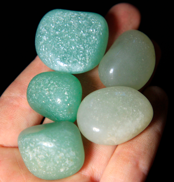 Small Tumbled Green Aventurine Pieces in hand for size