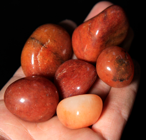 Small Tumbled Red Aventurine Pieces in hand for size