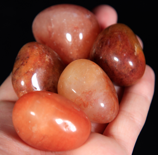 Medium Tumbled Red Aventurine Pieces in hand for size