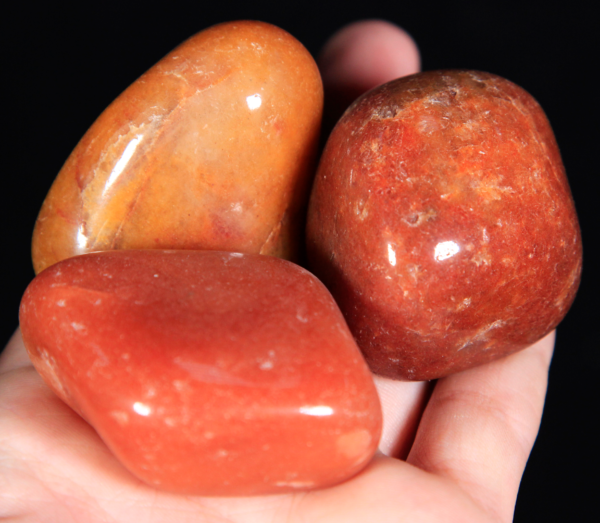 Large Tumbled Red Aventurine Pieces in hand for size