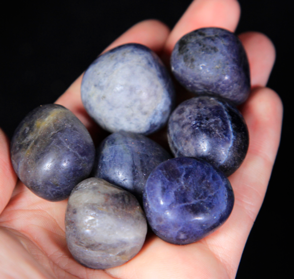Small Tumbled Iolite Pieces in hand for size