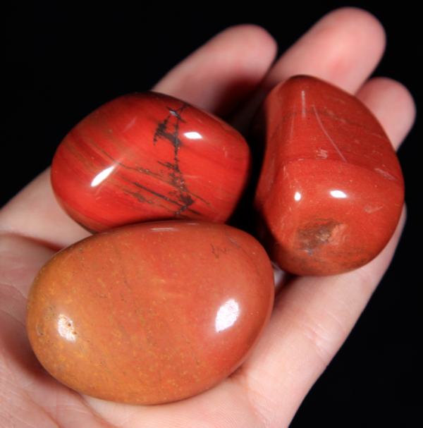 Large Tumbled Red Jasper Pieces in hand for size