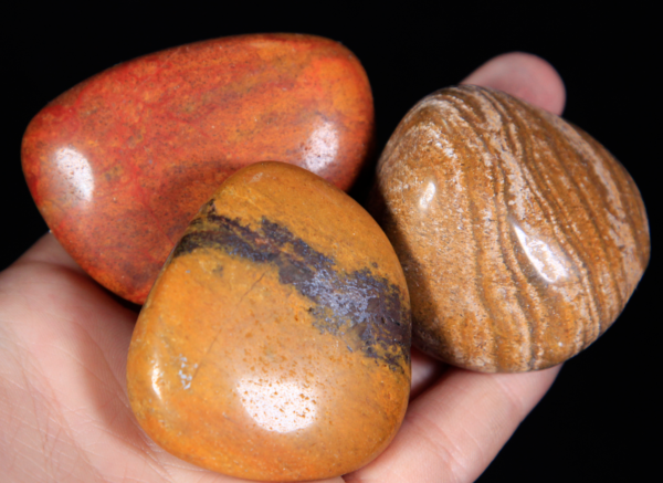Large Tumbled Yellow Jasper Pieces in hand for size