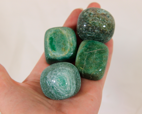 Large Jade Stones in hand for size comparison