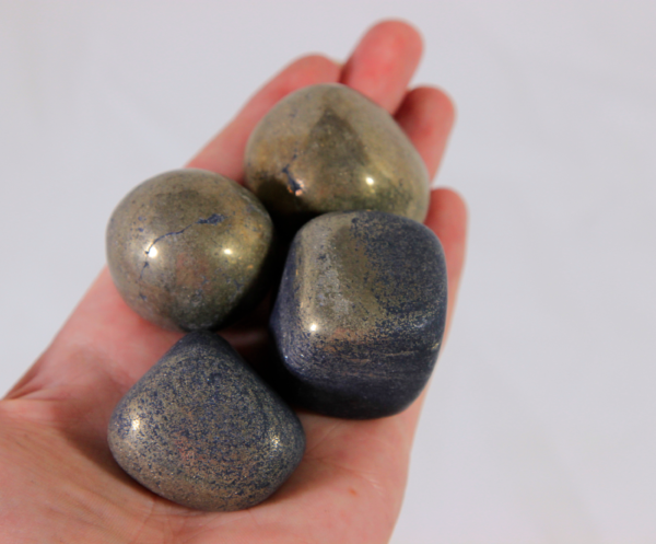 Large Pyrite Stones in hand for size comparison