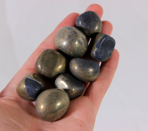 Small Pyrite Stones in hand for size comparison