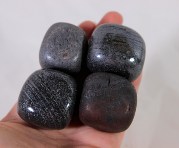 Large Hematite Stones in hand for size comparison