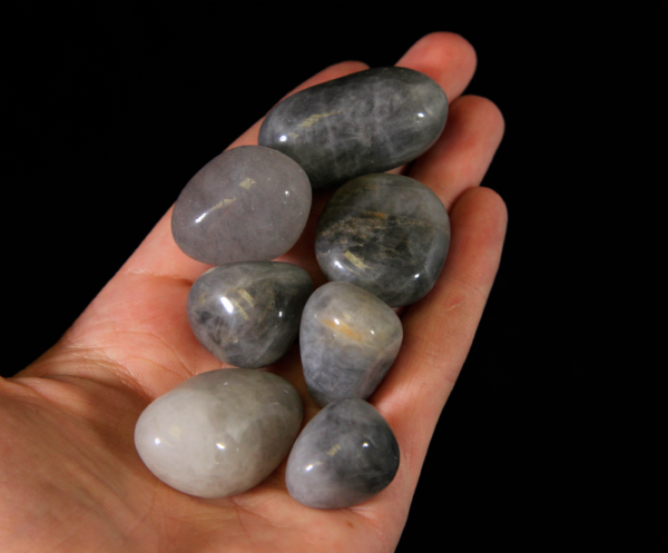 Small Tumbled Smokey Quartz Stones in Hand for Size Comparison