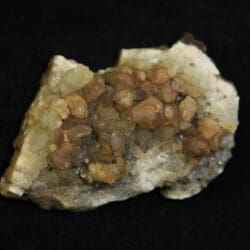 Orange and white Amethyst Crystal Cluster embedded in dark brown rock matrix