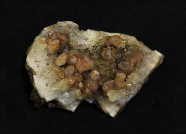 Orange and white Amethyst Crystal Cluster embedded in dark brown rock matrix