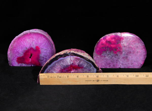 Three pairs of matching small pink Agate bookends next to ruler to show width