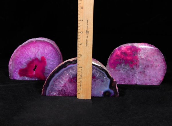Three pairs of matching small pink Agate bookends next to ruler to show height