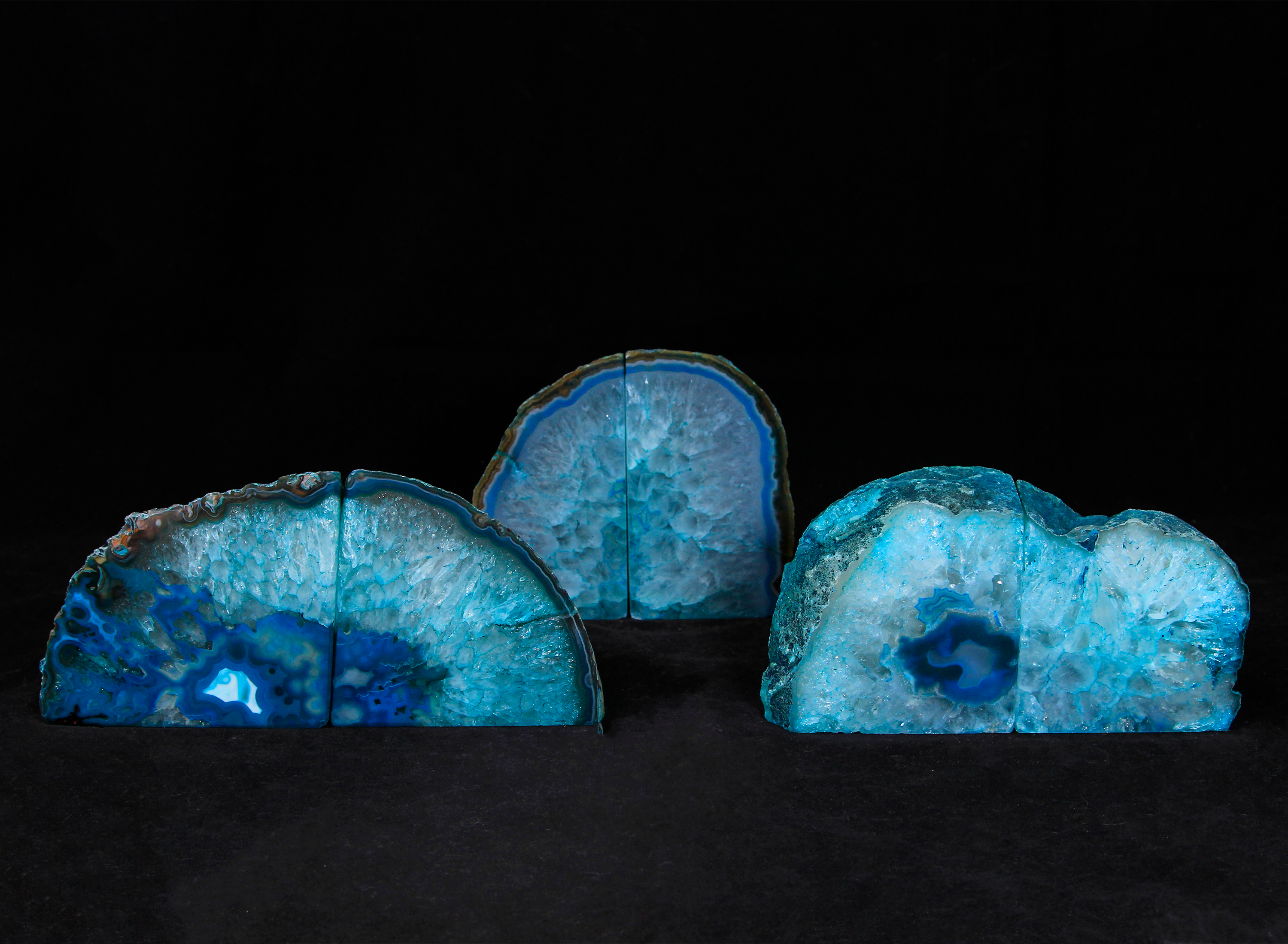 Three pairs of matching small teal Agate bookends
