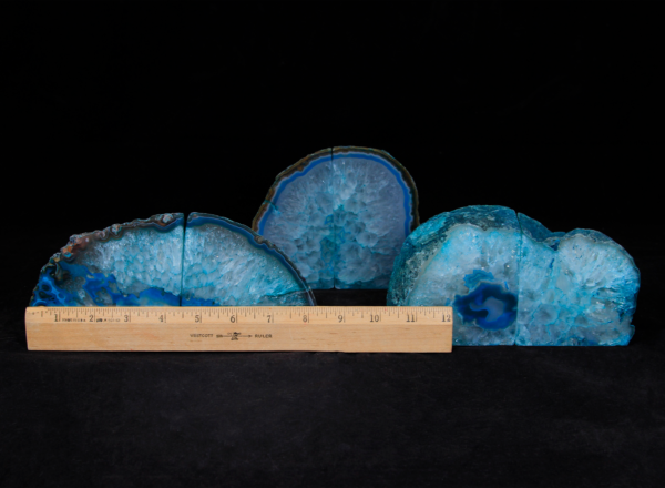 Three pairs of matching small teal Agate bookends next to ruler to show width