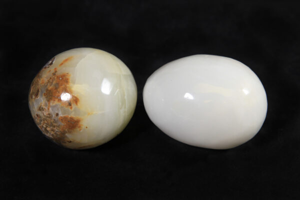 Two egg-shaped onyx marbles