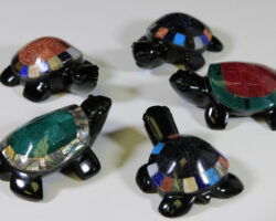 Five obsidian turtle figurines with assorted colored shells