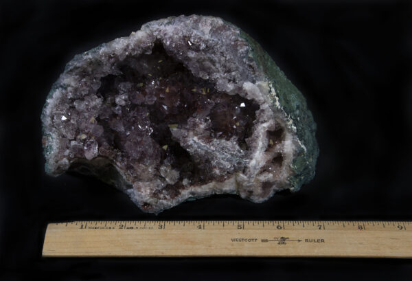 Smokey-colored Amethyst Geode with green rock for ruler