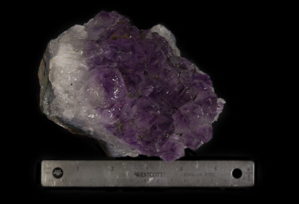 Amethyst Crystal with White Crystal Bed next to ruler