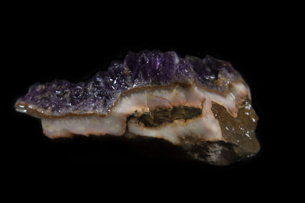 Purple colored Amethyst Crystal Cluster embedded in Pink rock matrix