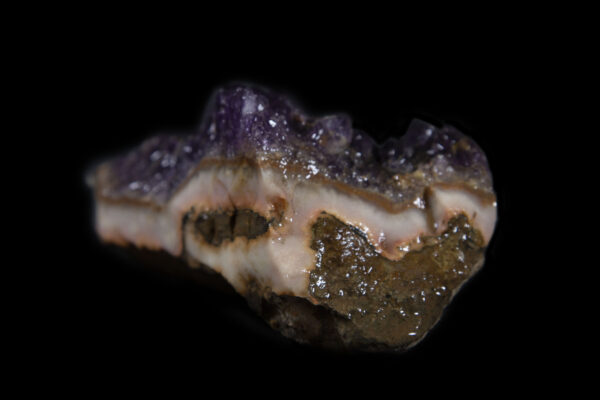 Purple colored Amethyst Crystal Cluster embedded in Pink rock matrix
