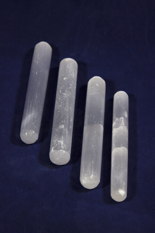 Four Selenite Crystal Massage Wands side by side