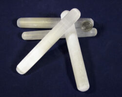 Selenite Crystal Massage Wands with coin for size comparison