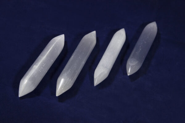 Four Double Sided Selenite Wands side by side
