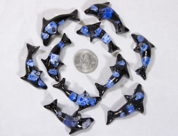 Baby Blue Precious Mineral Dolphin Figurines next to quarter for size comparison