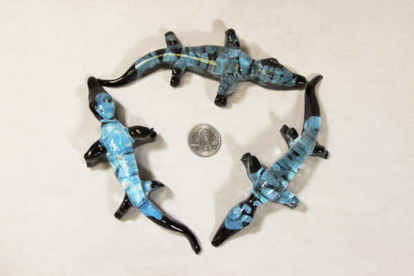 Blue Precious Mineral Alligator Figurines next to quarter for size comparison