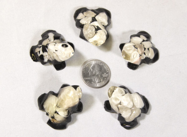 Small White Precious Mineral Frog Figurines next to quarter for size comparison