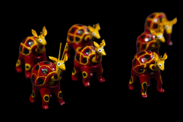 Set of several Red Looseneck Giraffes Figurines side