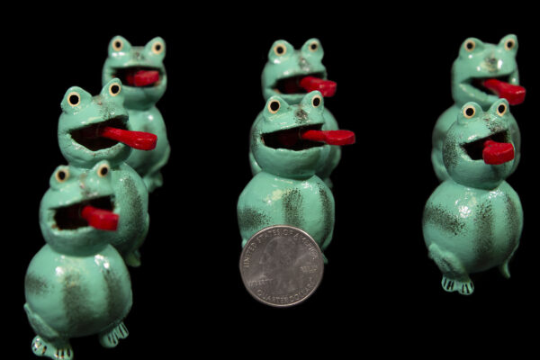 Set of several Green Looseneck Toad Figurines with quarter size comparison