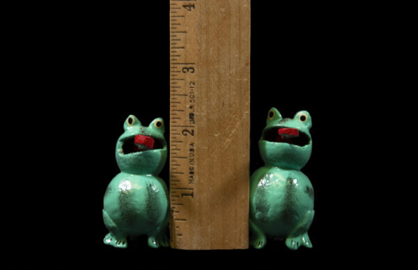 Two Green Looseneck Toad Figurines next to ruler for size comparison