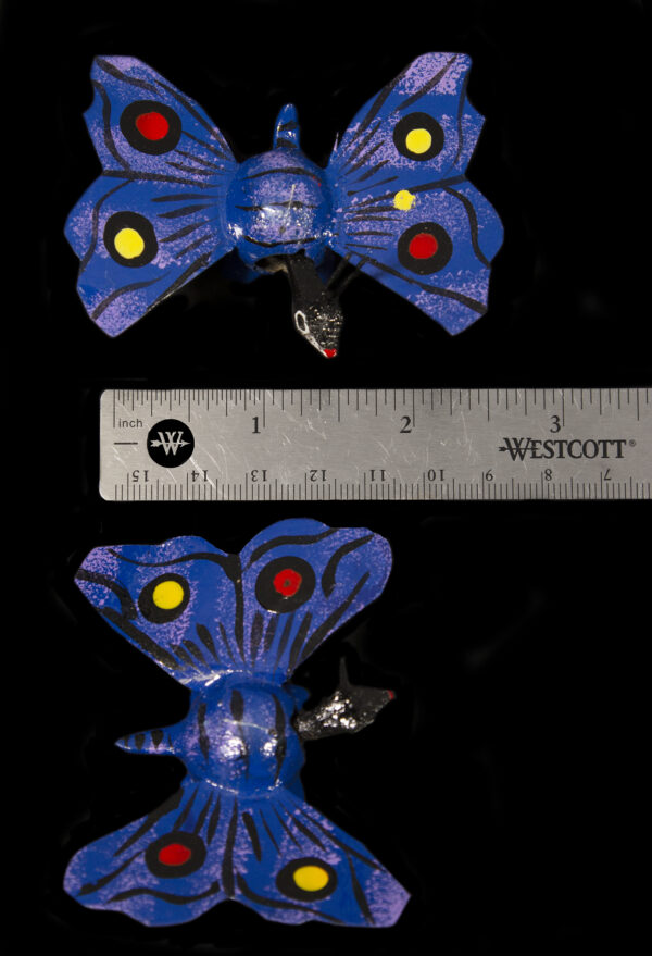Two Dark Blue Looseneck Butterfly Figurines next to ruler for size comparison