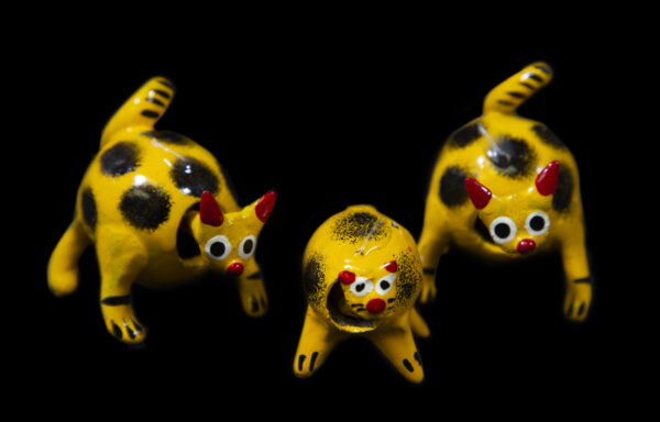 Yellow Looseneck Cat Figurines front view