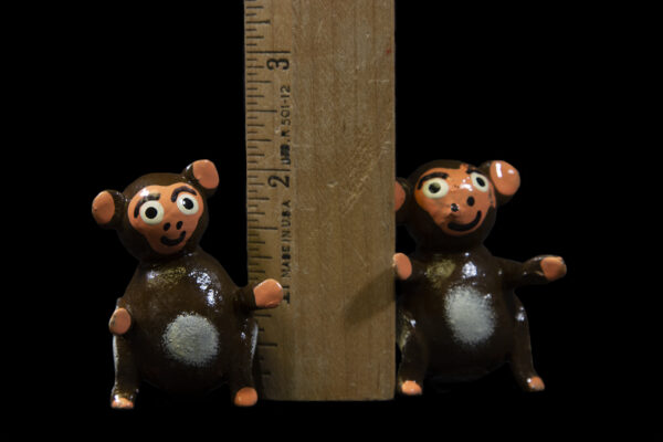Looseneck Monkey Figurines next to ruler for size comparison