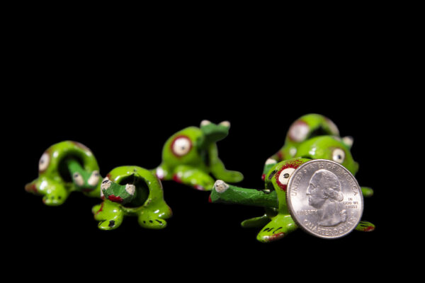 Green Looseneck Frog Figurines with quarter for size comparison