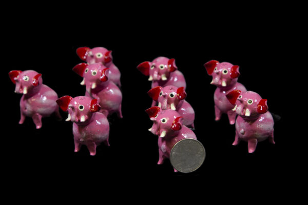 Looseneck Pink Elephant Figurines with quarter for size comparison