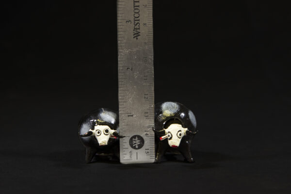 Looseneck Bull Figurines next to ruler for size comparison