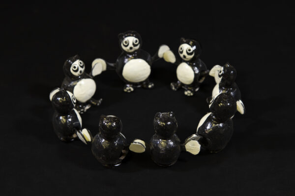 Black and White Looseneck Panda Figurines in circle