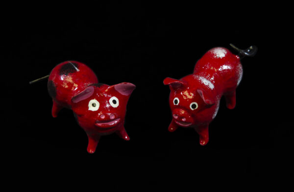 Red Looseneck Pig Figurines made from dried limoncello fruit