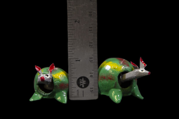 Green Looseneck Mice Figurines next to ruler for size comparison