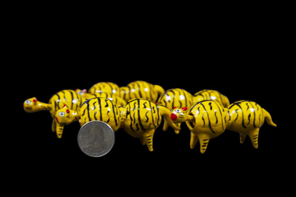 Yellow Looseneck Tiger Figurines with quarter size comparison