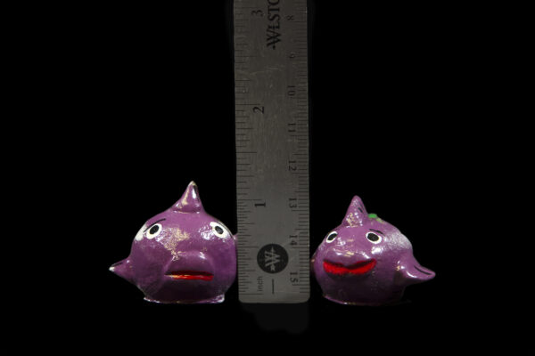 Two LooseNeck Flat Fish Figurines next to ruler for size comparison