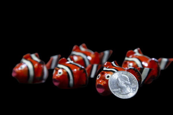 Red LooseNeck Clownfish Figurines with quarter size comparison